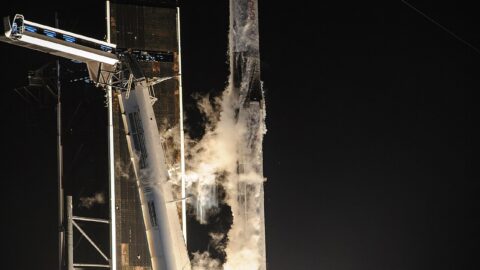 A Falcon 9 rocket lifting off at night