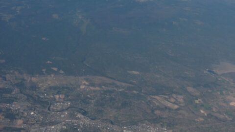 Aerial view of Bend Oregon with the Cascade mountains beyond