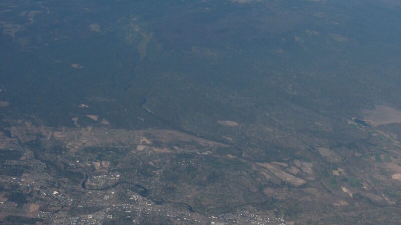 Aerial view of Bend Oregon with the Cascade mountains beyond