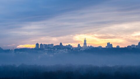 Kyiv skyline at dawn with morning mist over the city