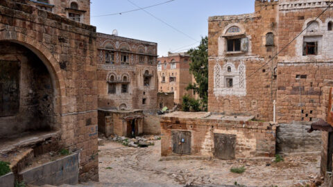 Old stone buildings on a street in Taiz Yemen